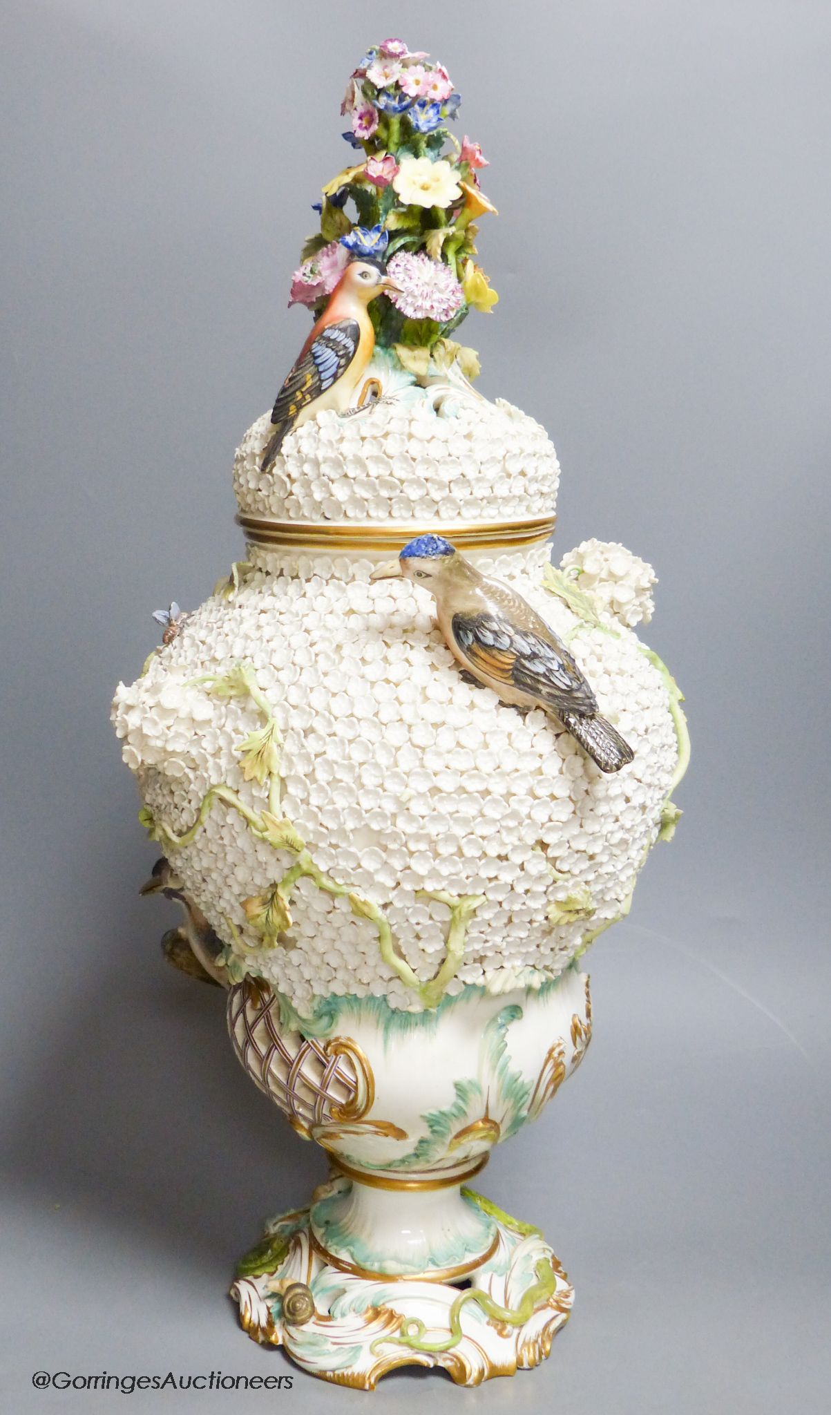 A large 19th century Continental porcelain floral encrusted vase and cover, height 58cm